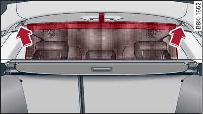 Behind the rear backrest: Hooking the load guard into place